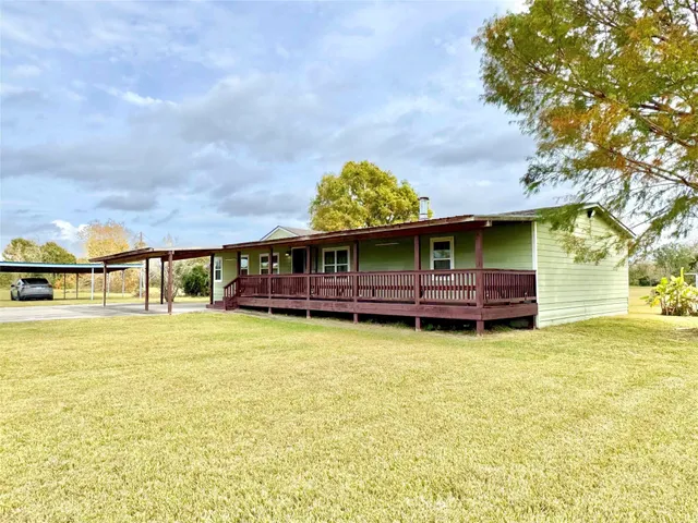 a view of swimming pool with seating area