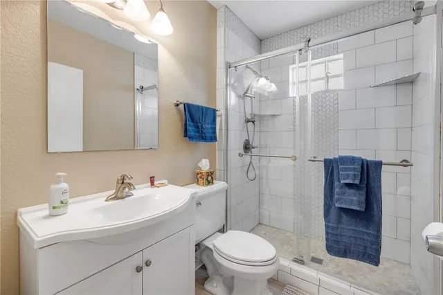 a living room with furniture a fireplace and a window
