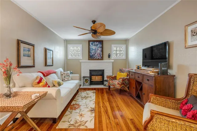 a kitchen with stainless steel appliances kitchen island granite countertop a refrigerator and a stove top oven