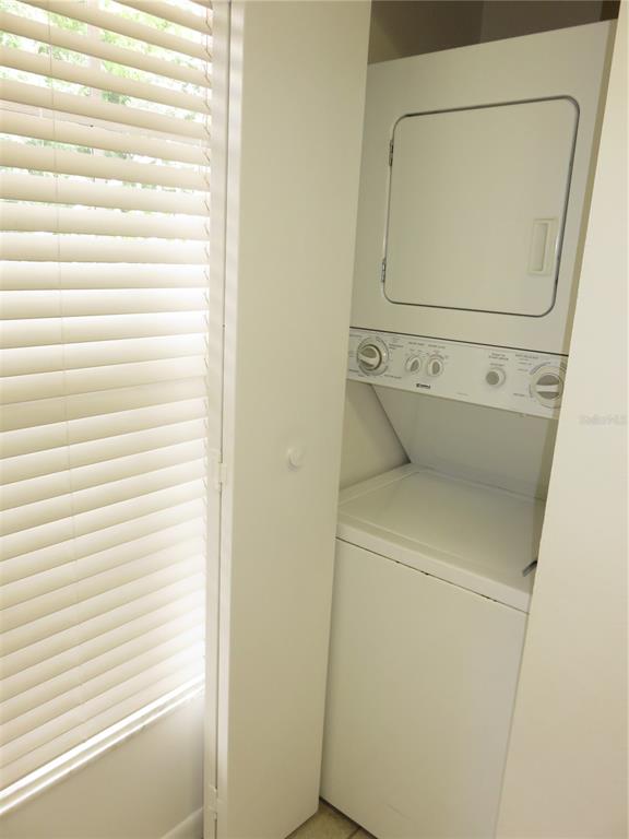 4911 Sunnybrook Drive, Unit 12 New Port Richey, FL 34653 - Photo 11 of 32 a utility room with a washer and dryer