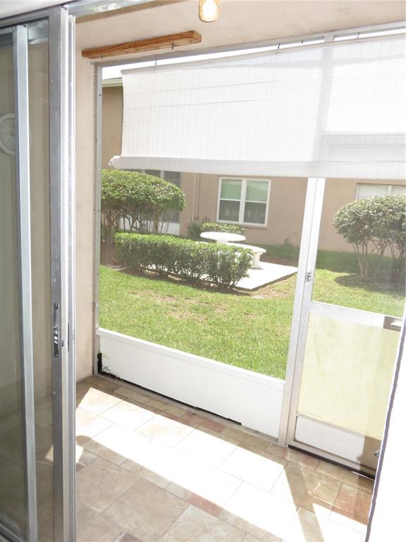 4911 Sunnybrook Drive, Unit 12 New Port Richey, FL 34653 - Photo 12 of 32 a view of backyard with large window