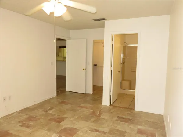 a view of an empty room with a window