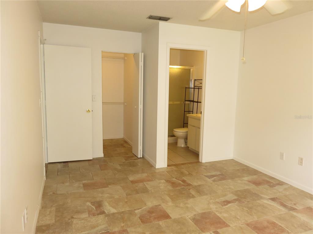 4911 Sunnybrook Drive, Unit 12 New Port Richey, FL 34653 - Photo 15 of 32 an empty room with closet