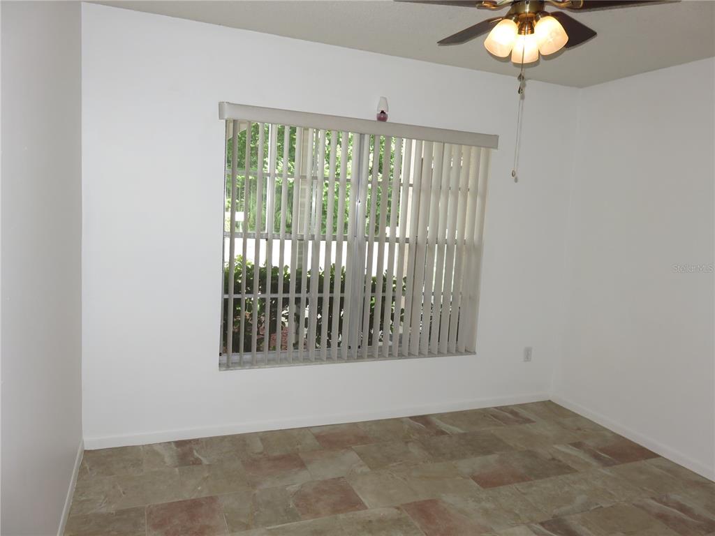 4911 Sunnybrook Drive, Unit 12 New Port Richey, FL 34653 - Photo 17 of 32 a view of an empty room with a window