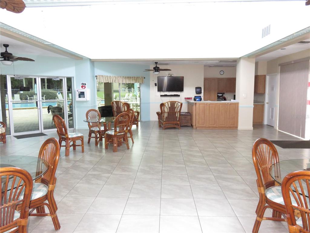 4911 Sunnybrook Drive, Unit 12 New Port Richey, FL 34653 - Photo 24 of 32 a view of a dining room kitchen and furniture