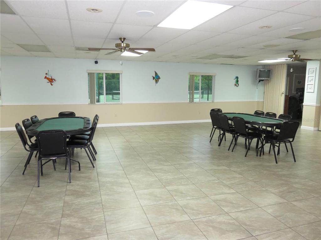 4911 Sunnybrook Drive, Unit 12 New Port Richey, FL 34653 - Photo 25 of 32 a view of a dining room with furniture