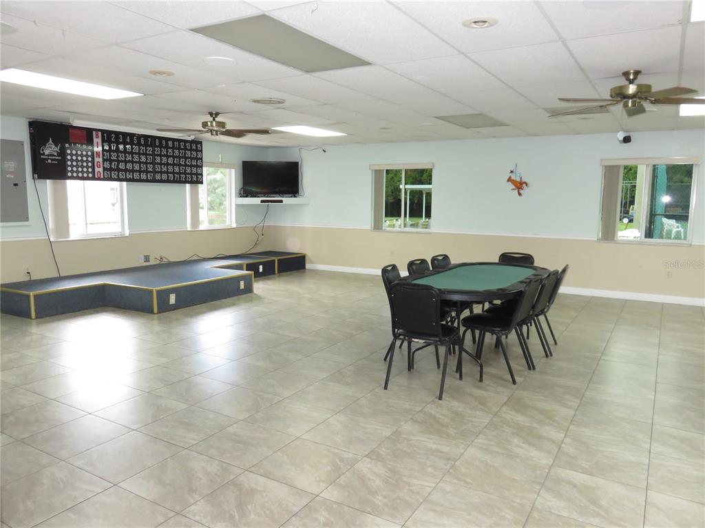 4911 Sunnybrook Drive, Unit 12 New Port Richey, FL 34653 - Photo 26 of 32 a dining room with furniture and a large window
