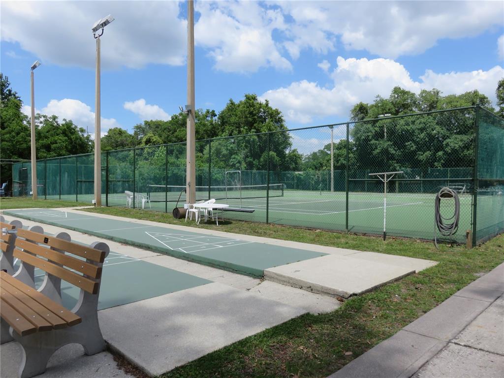 4911 Sunnybrook Drive, Unit 12 New Port Richey, FL 34653 - Photo 28 of 32 a view of a patio with a table
