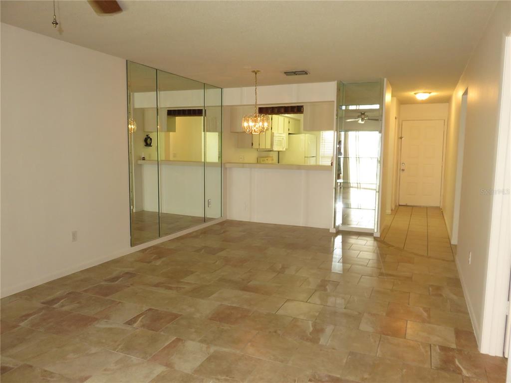 4911 Sunnybrook Drive, Unit 12 New Port Richey, FL 34653 - Photo 4 of 32 a view of empty room with wooden floor