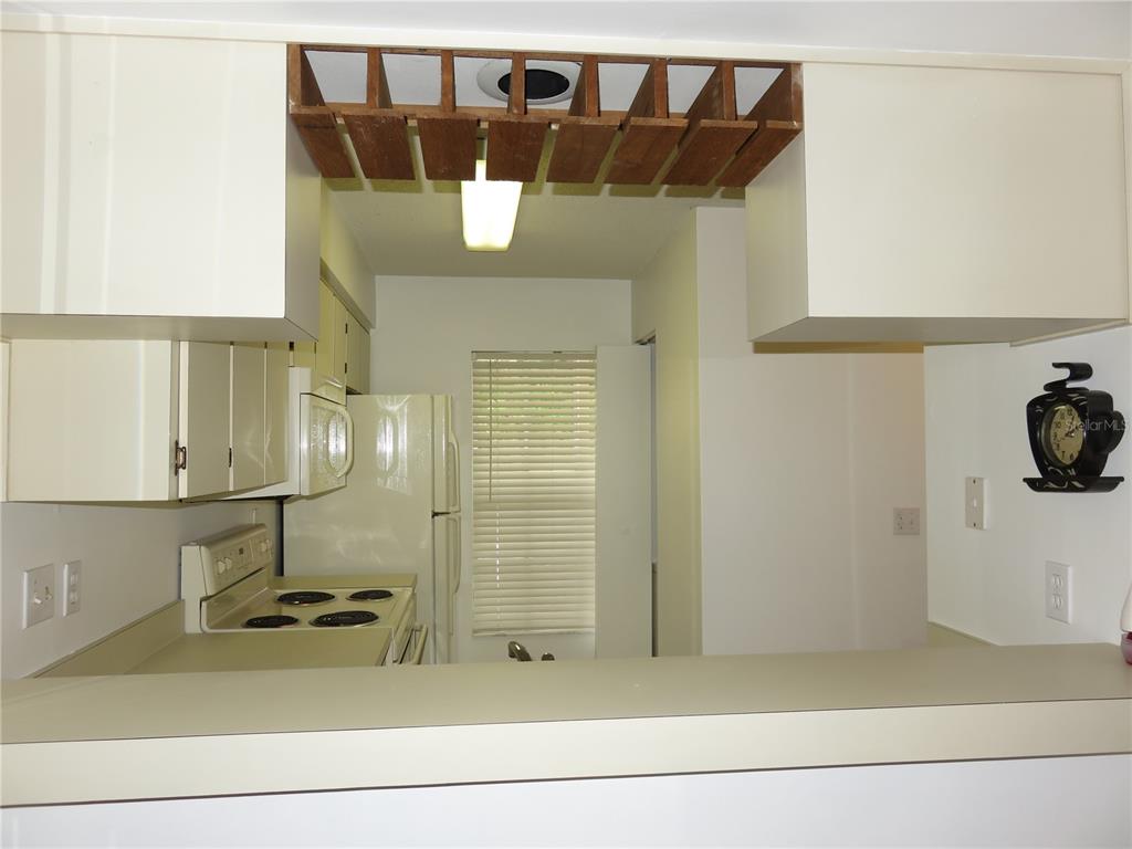 4911 Sunnybrook Drive, Unit 12 New Port Richey, FL 34653 - Photo 8 of 32 a bathroom with a sink and a mirror