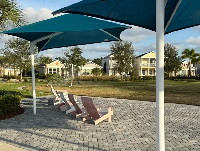 a view of a swimming pool with a patio