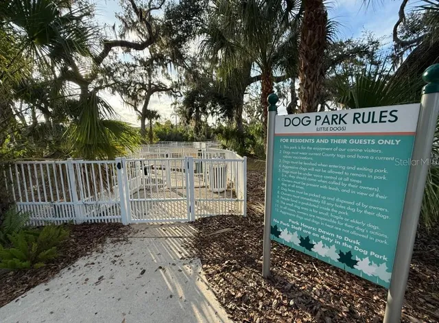 a view of a porch with furniture and a yard