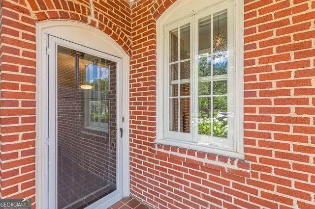 a view of a livingroom with furniture window and wooden floor