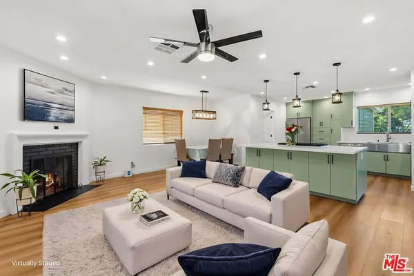 a living room with furniture and a fireplace