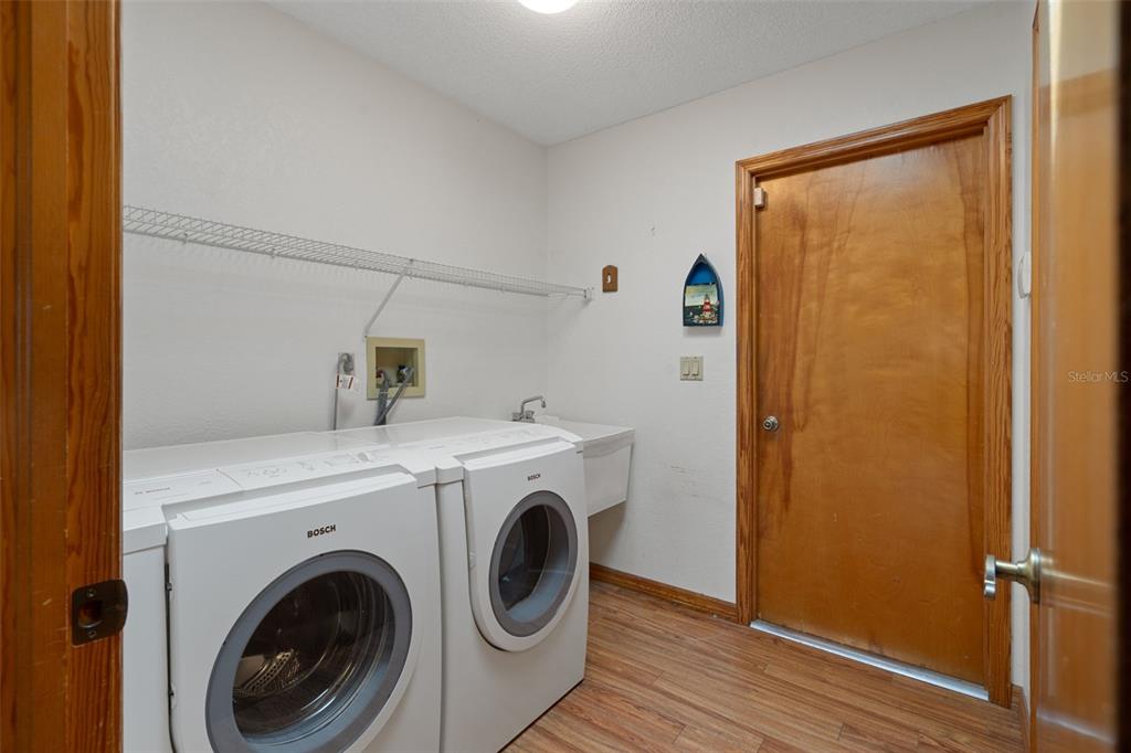 5035 Harbinger Road Spring Hill, FL 34608 - Photo 28 of 47 a utility room with dryer and washer