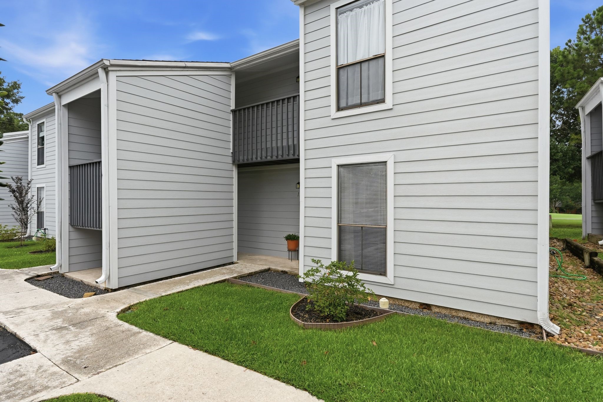 13151 Walden Road, Unit 131 Montgomery, TX 77356 - Photo 34 of 35 Charming exterior with manicured landscaping and a convenient entry path.