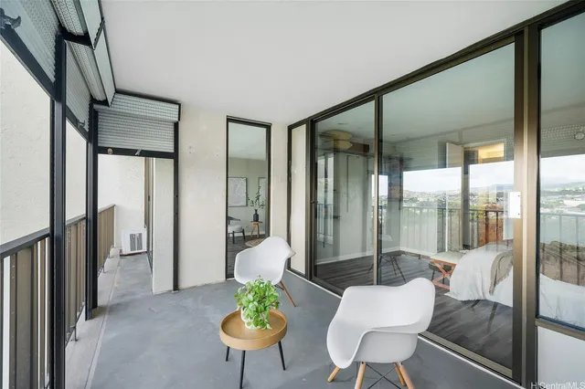 a view of a dining room with furniture a livingroom and chandelier