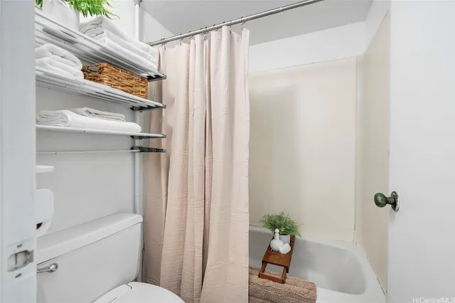 a bathroom with a shower curtain