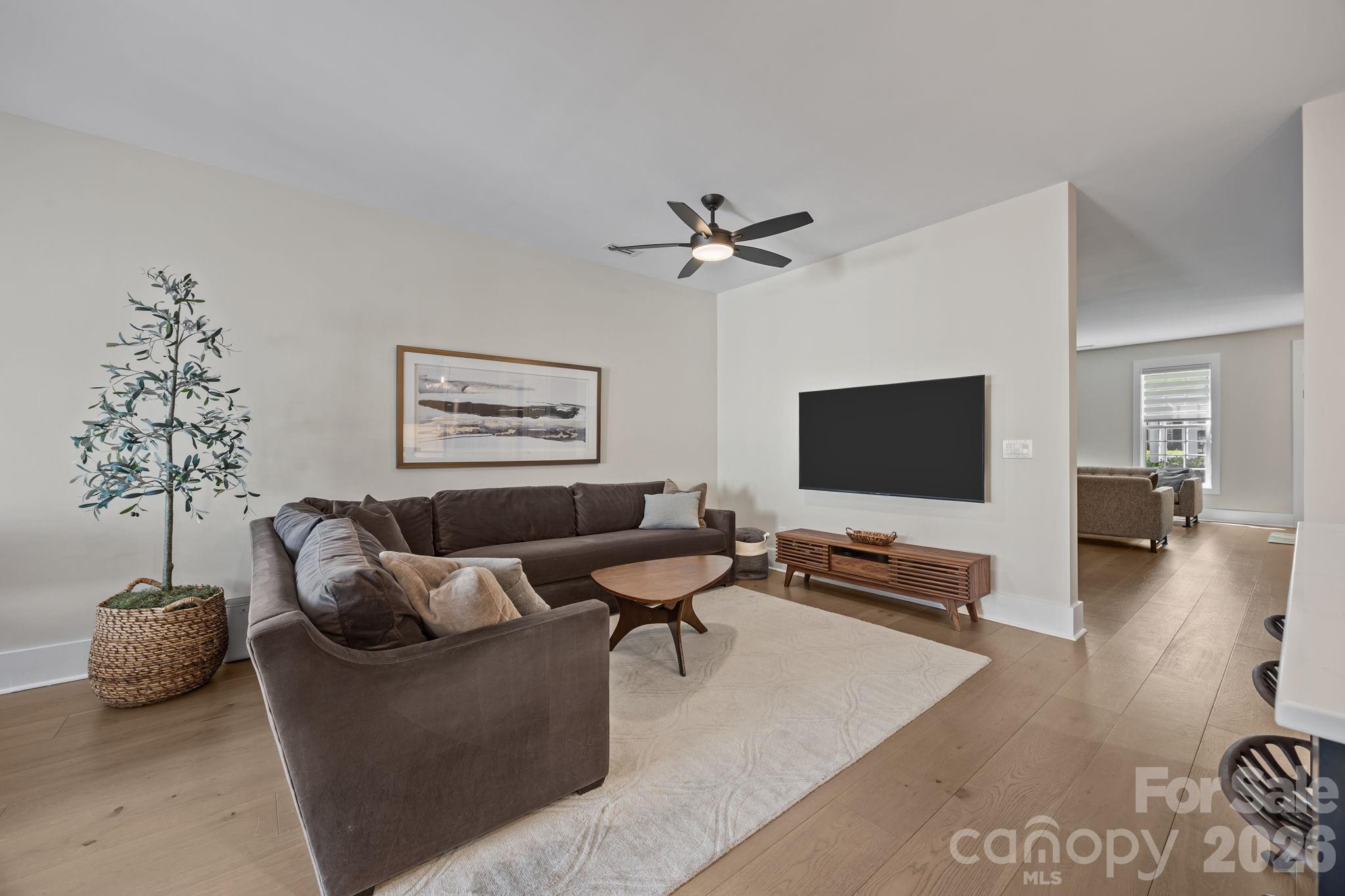 241 North Faulkner Way Davidson, NC 28036 - Photo 12 of 39 a living room with furniture and a flat screen tv