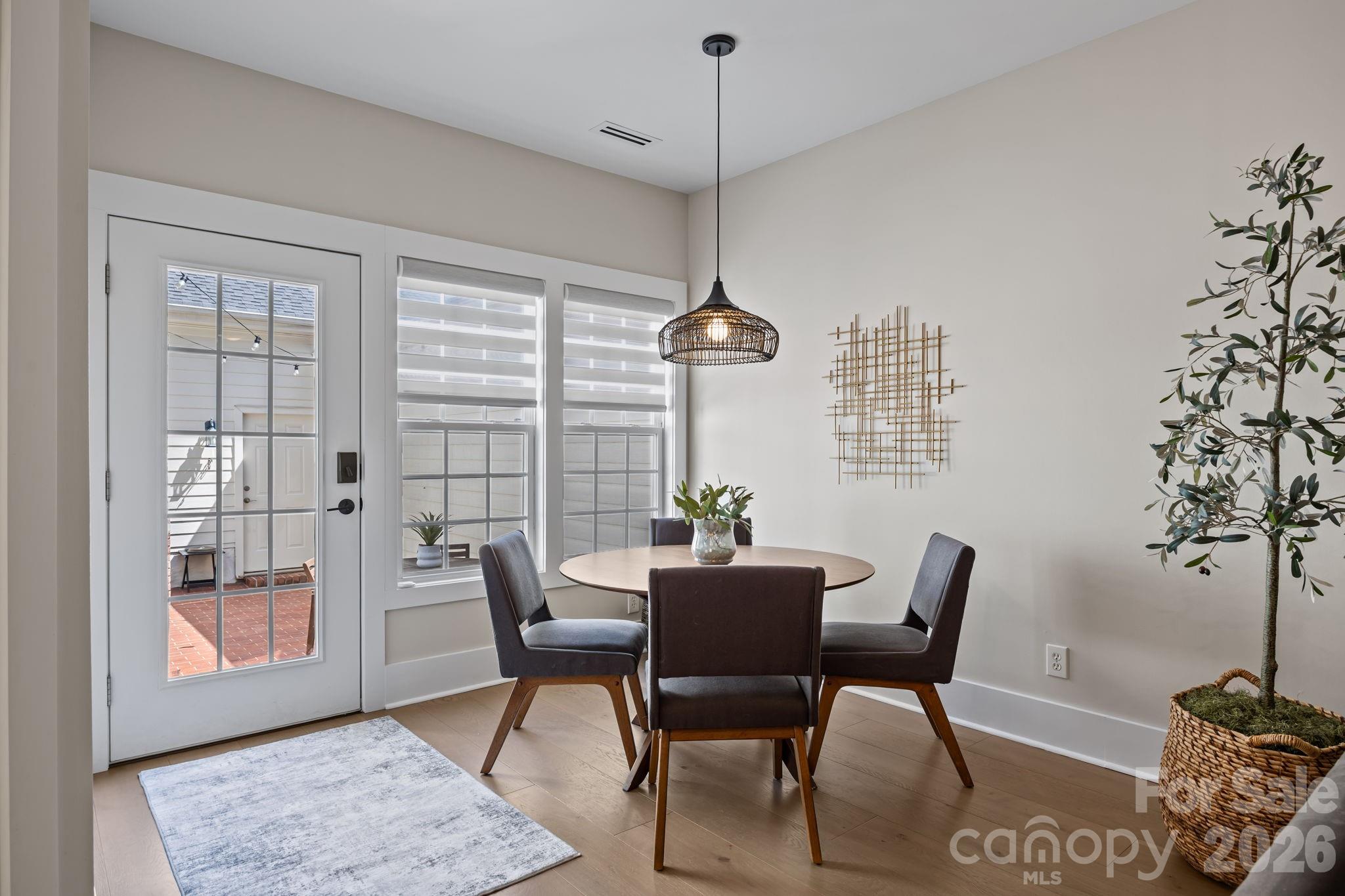 241 North Faulkner Way Davidson, NC 28036 - Photo 14 of 39 a view of a dining room with furniture window and wooden floor