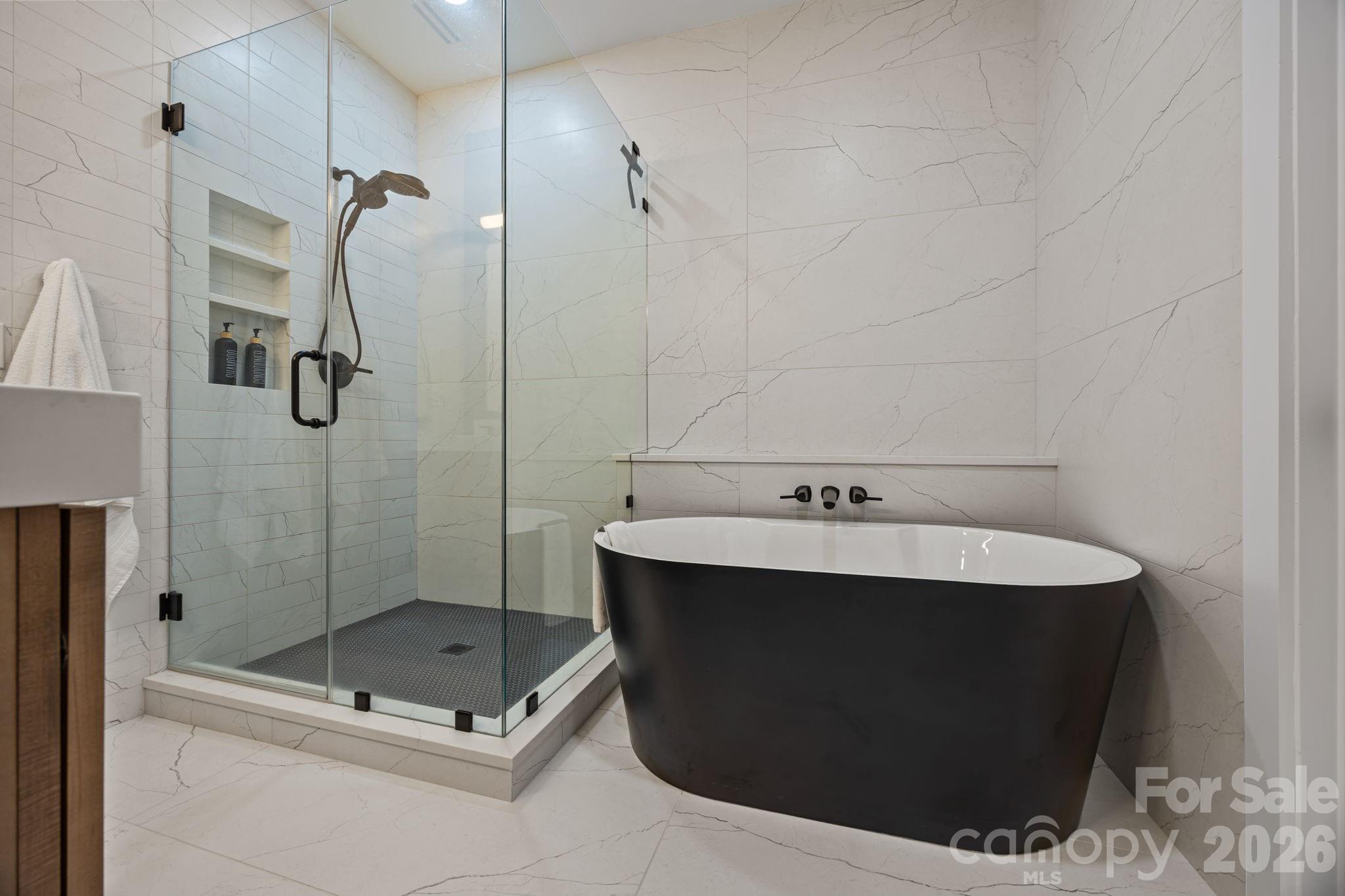 241 North Faulkner Way Davidson, NC 28036 - Photo 21 of 39 a bathroom with a sink mirror and shower