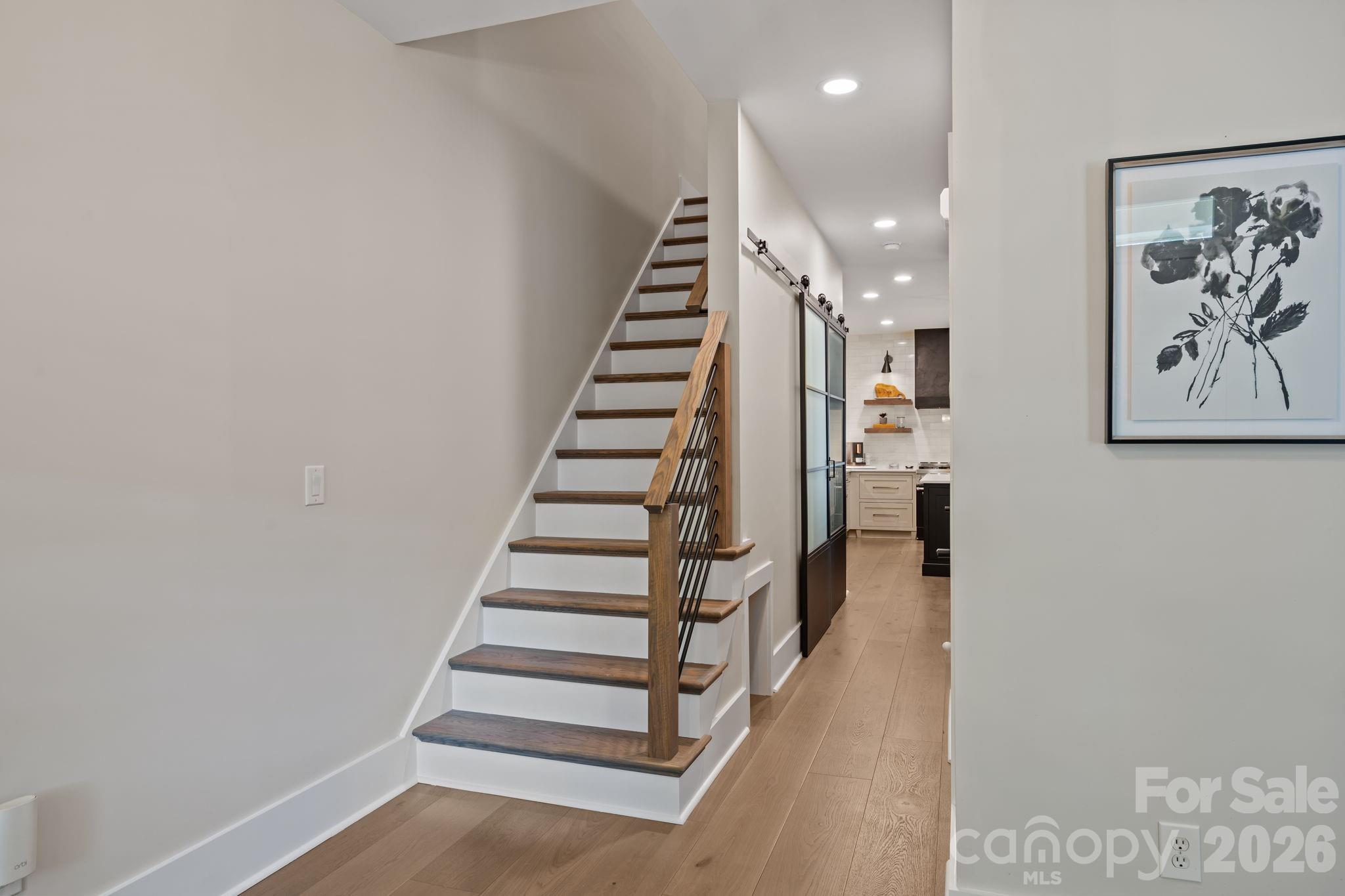 241 North Faulkner Way Davidson, NC 28036 - Photo 23 of 39 a view of entryway with stairs and wooden floor