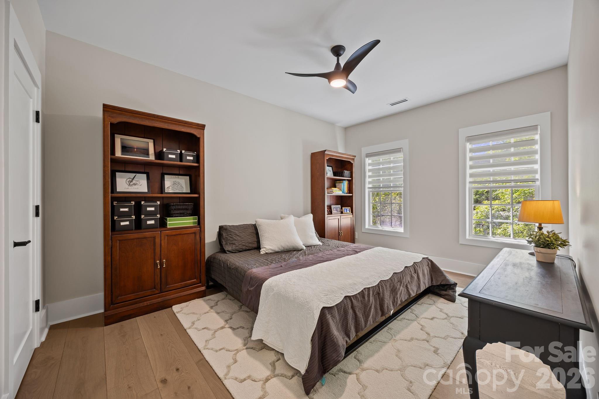 241 North Faulkner Way Davidson, NC 28036 - Photo 27 of 39 a bedroom with a bed a dresser and a window