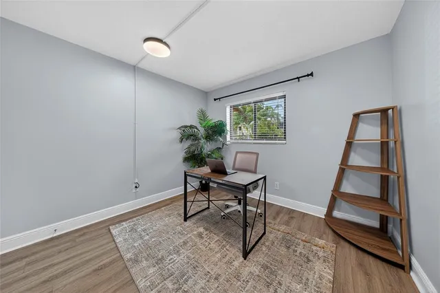 a work room with furniture and a window