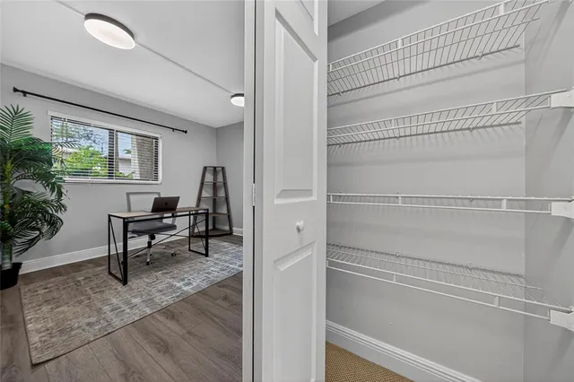 a view of a livingroom with furniture and window
