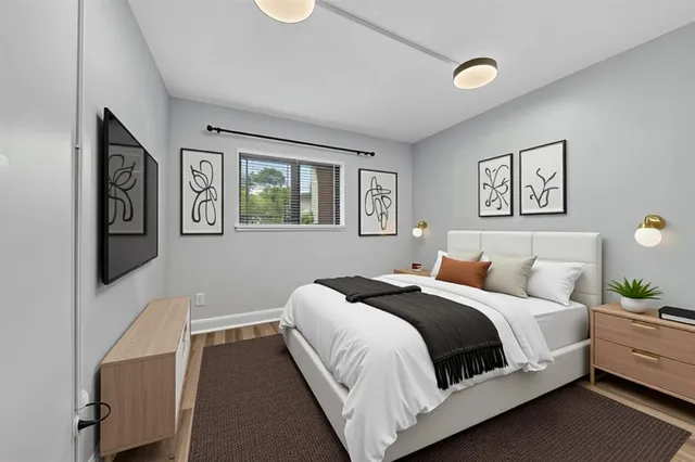 a bedroom with a large bed and a couch