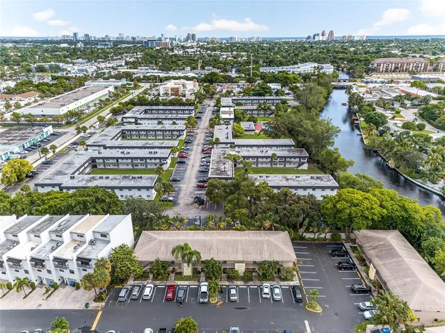 an aerial view of residential houses with outdoor space