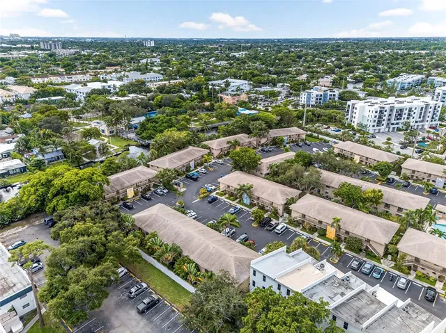 an aerial view of residential houses with outdoor space