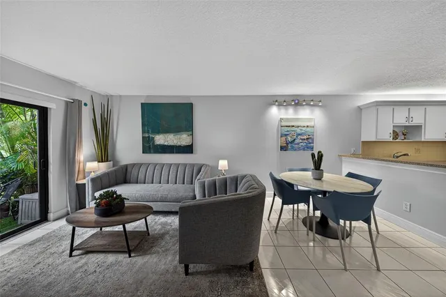 a work room with furniture and a large window