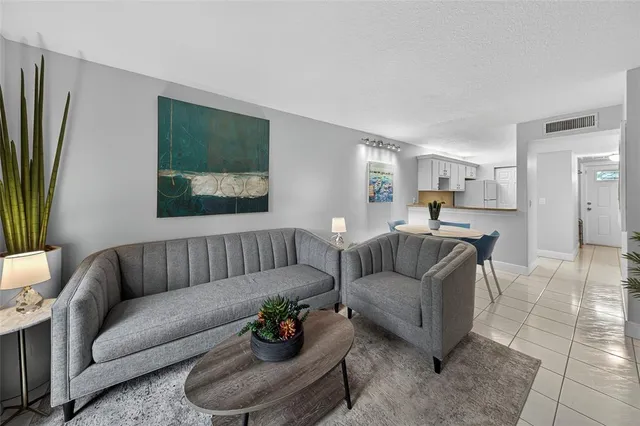 a living room with furniture and a couch