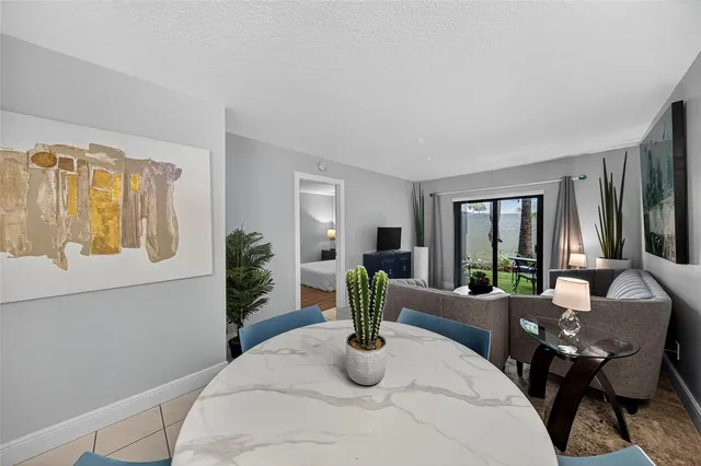 a bedroom with furniture and a potted plant