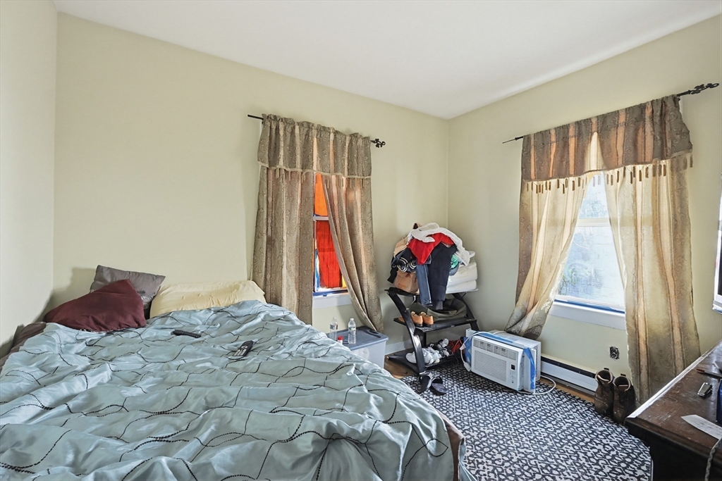15 Kenneson Road Somerville, MA 02145 - Photo 13 of 18 a bedroom with a bed and a window