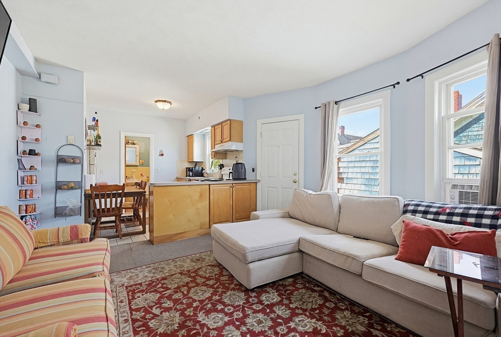 15 Kenneson Road Somerville, MA 02145 - Photo 3 of 18 a living room with furniture and a large window