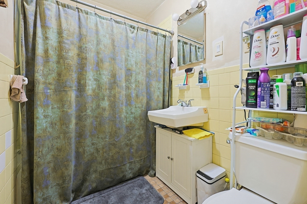 15 Kenneson Road Somerville, MA 02145 - Photo 6 of 18 a bathroom with a sink toilet and shower