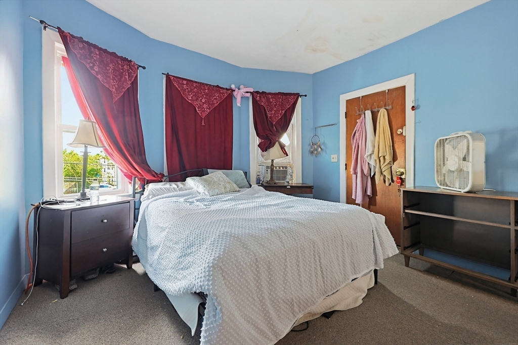 15 Kenneson Road Somerville, MA 02145 - Photo 8 of 18 a bedroom with a bed and window