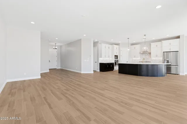 a view of kitchen and kitchen with stainless steel appliances
