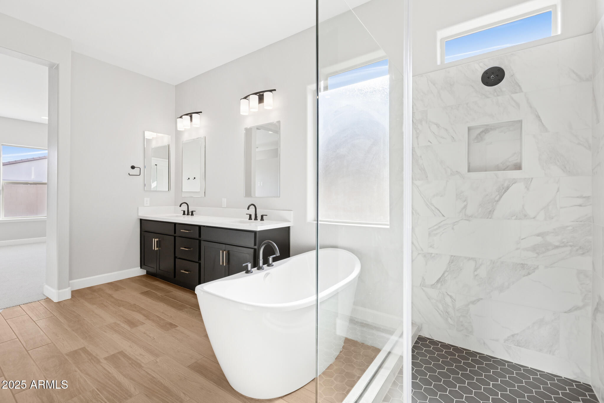 953 Ridge Road Apache Junction, AZ 85120 - Photo 9 of 18 a spacious bathroom with a double vanity sink a mirror and a bathtub