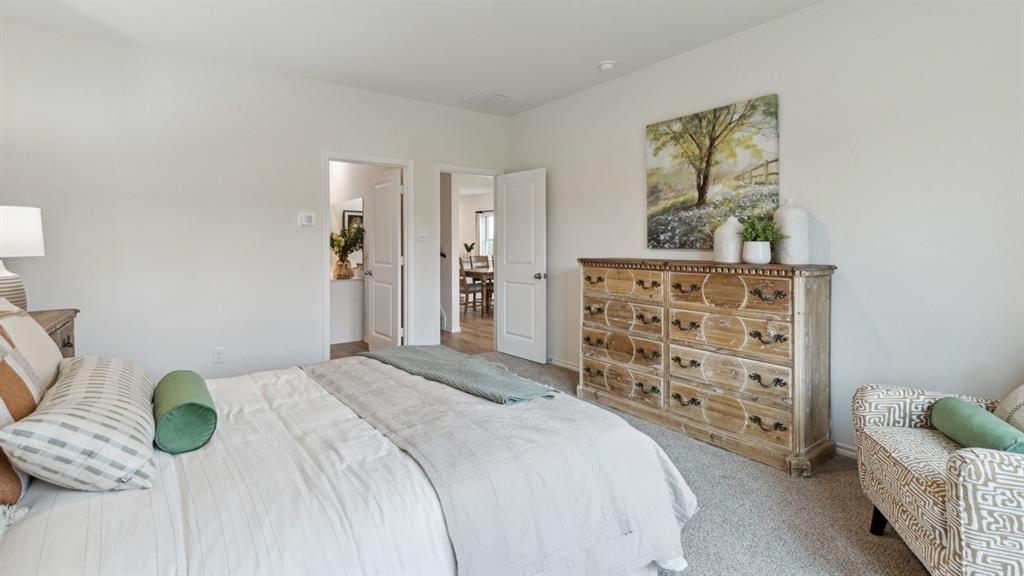 140 Pheasant Run Road Terrell, TX 75160 - Photo 19 of 26 Spacious bedroom featuring light neutral wall tones and plush carpeting