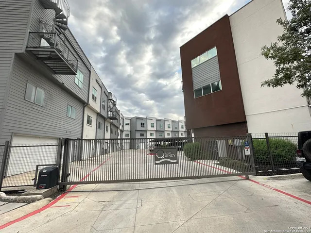 a view of a house with a tv on a road