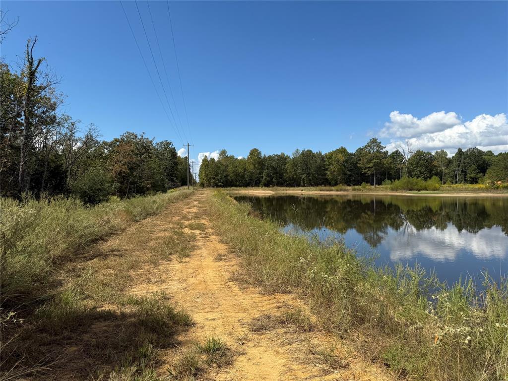 154 St Quitman Tx 75783 Quitman, TX 75783 - Photo 32 of 35 a view of a lake with a mountain in the background