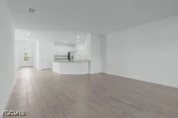a view of a kitchen with a sink and a window