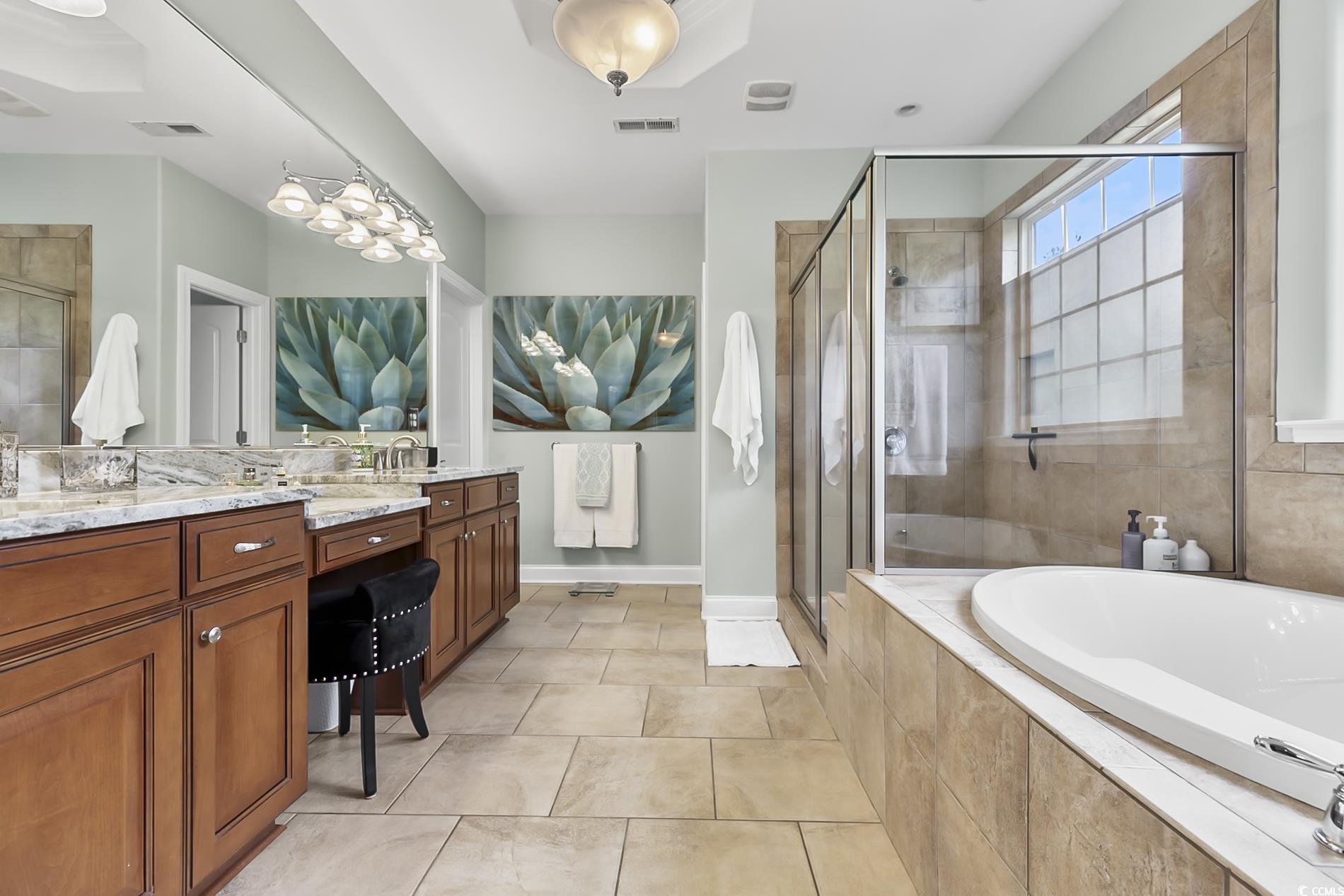 4000 Girvan Drive Myrtle Beach, SC 29579 - Photo 25 of 40 Full bath with a bath, a stall shower, vanity, and light tile patterned floors