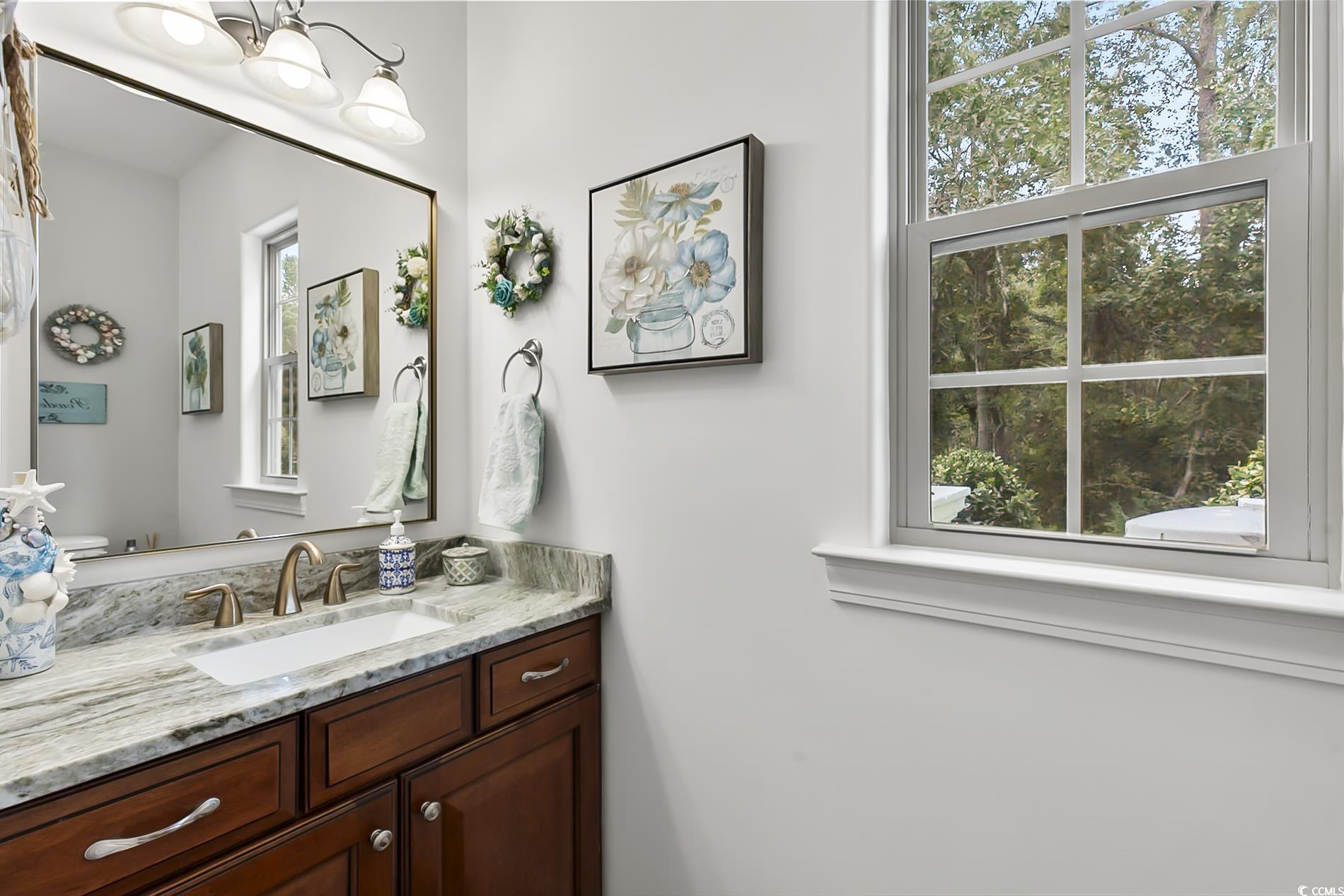 4000 Girvan Drive Myrtle Beach, SC 29579 - Photo 29 of 40 Bathroom with vanity and a chandelier