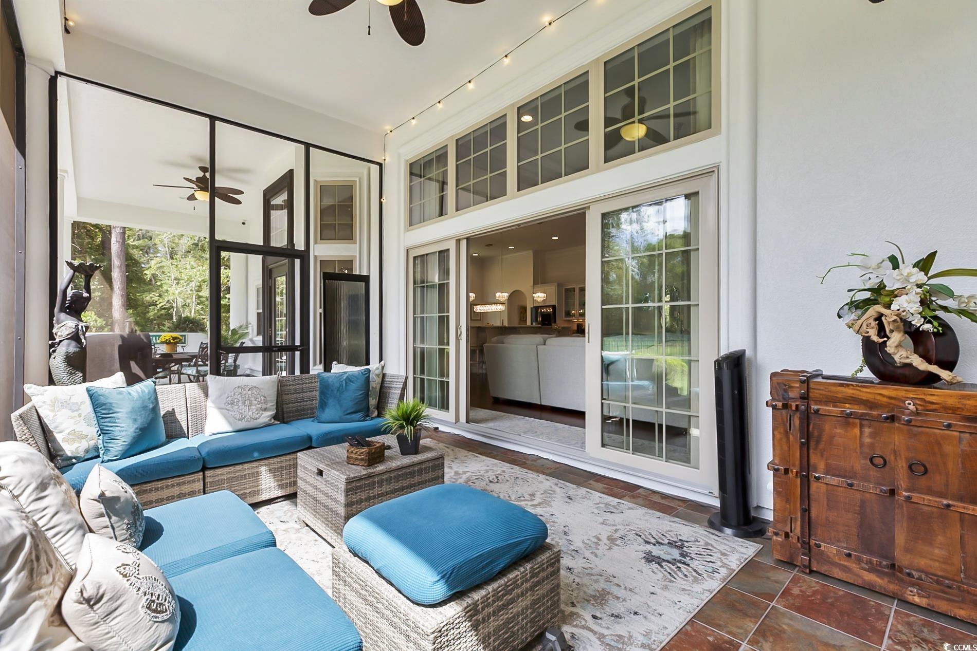 4000 Girvan Drive Myrtle Beach, SC 29579 - Photo 32 of 40 Sunroom with a patio, an outdoor living space, and a ceiling fan