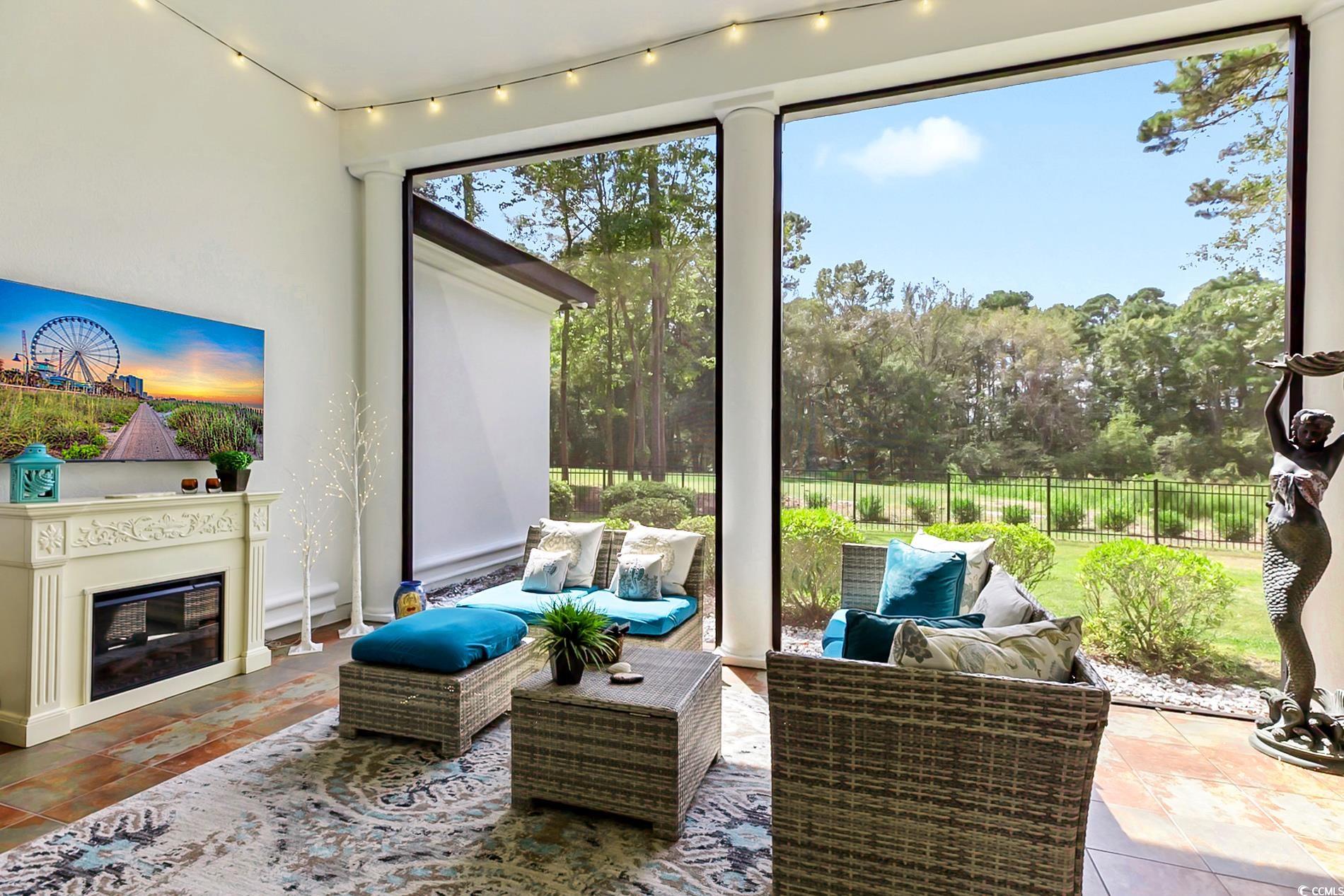 4000 Girvan Drive Myrtle Beach, SC 29579 - Photo 33 of 40 Sunroom with view of wooded area