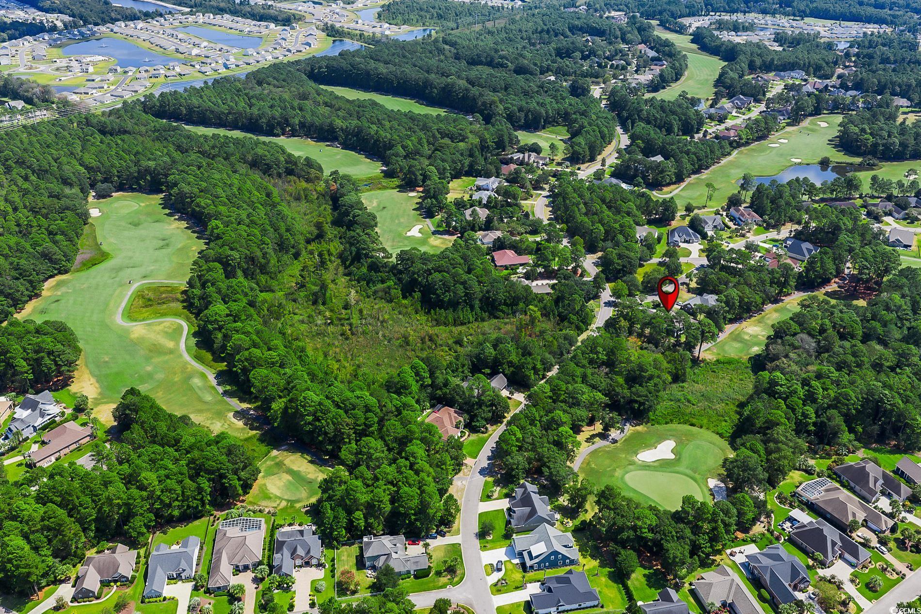 4000 Girvan Drive Myrtle Beach, SC 29579 - Photo 37 of 40 Aerial view of property's location featuring a golf course and nearby suburban area